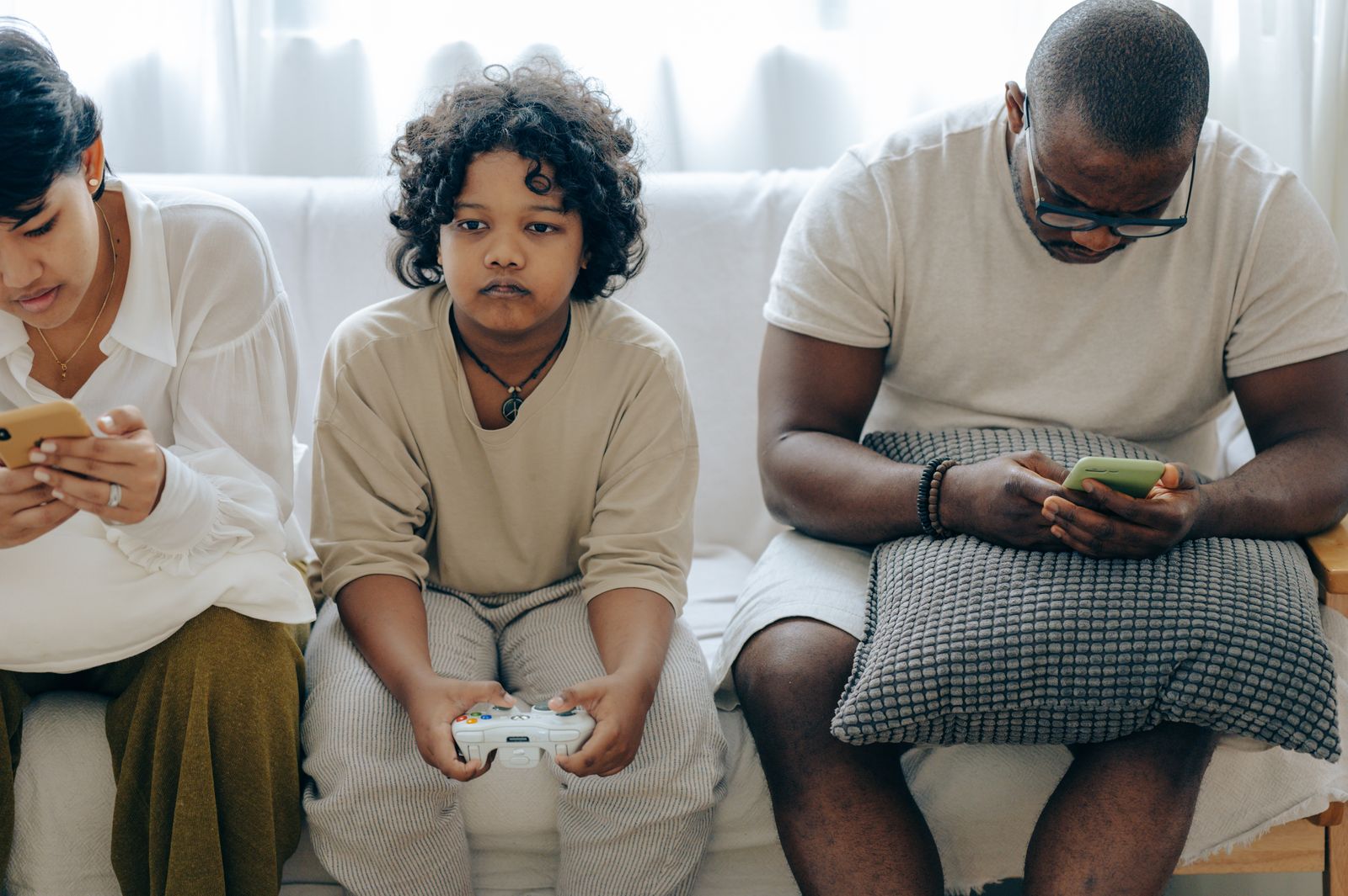 Multiracial family relaxing together at home